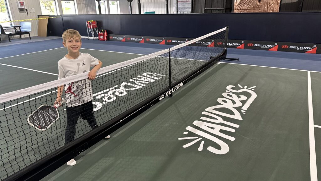 Child on pickleball court